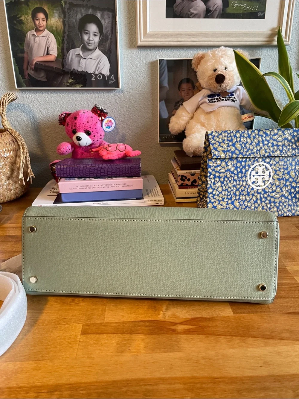 The Kate Spade KK114 refers specifically to the Phoebe East West Satchel